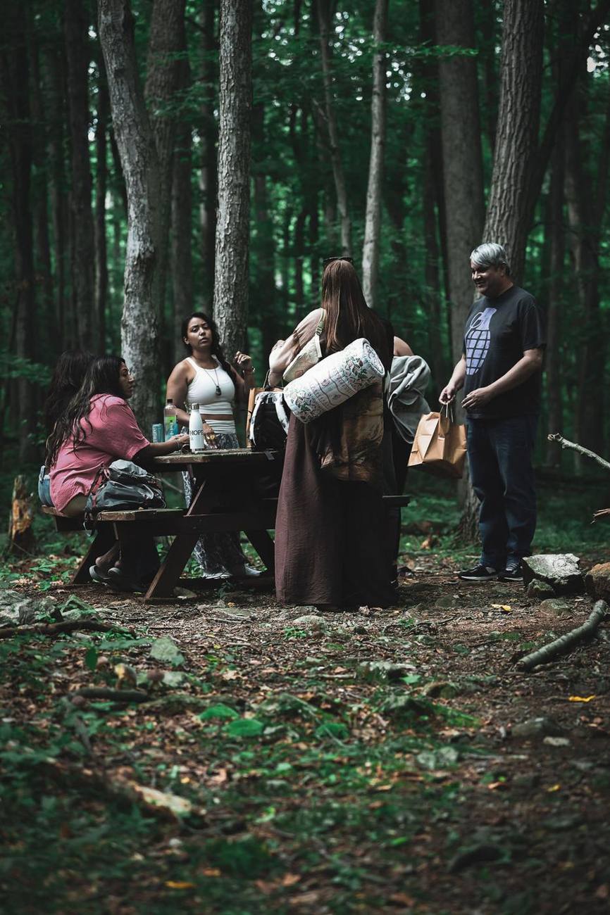 Retreat guests gathered in the forest