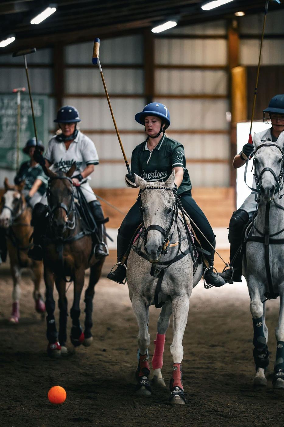 Polo players lined up for the throw-in