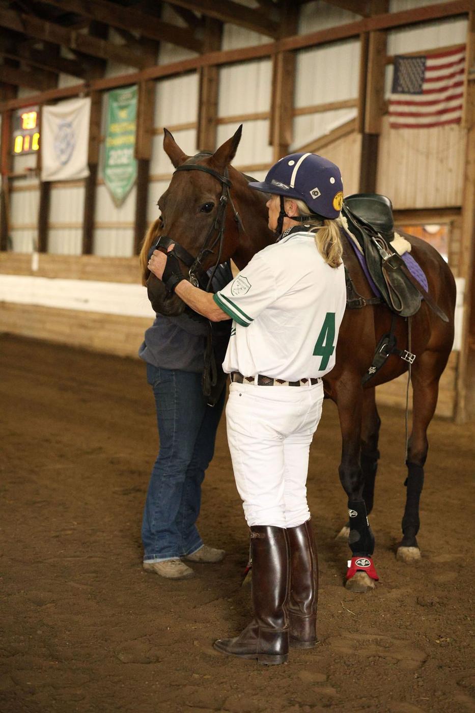 Polo player hugging her horse on opening day