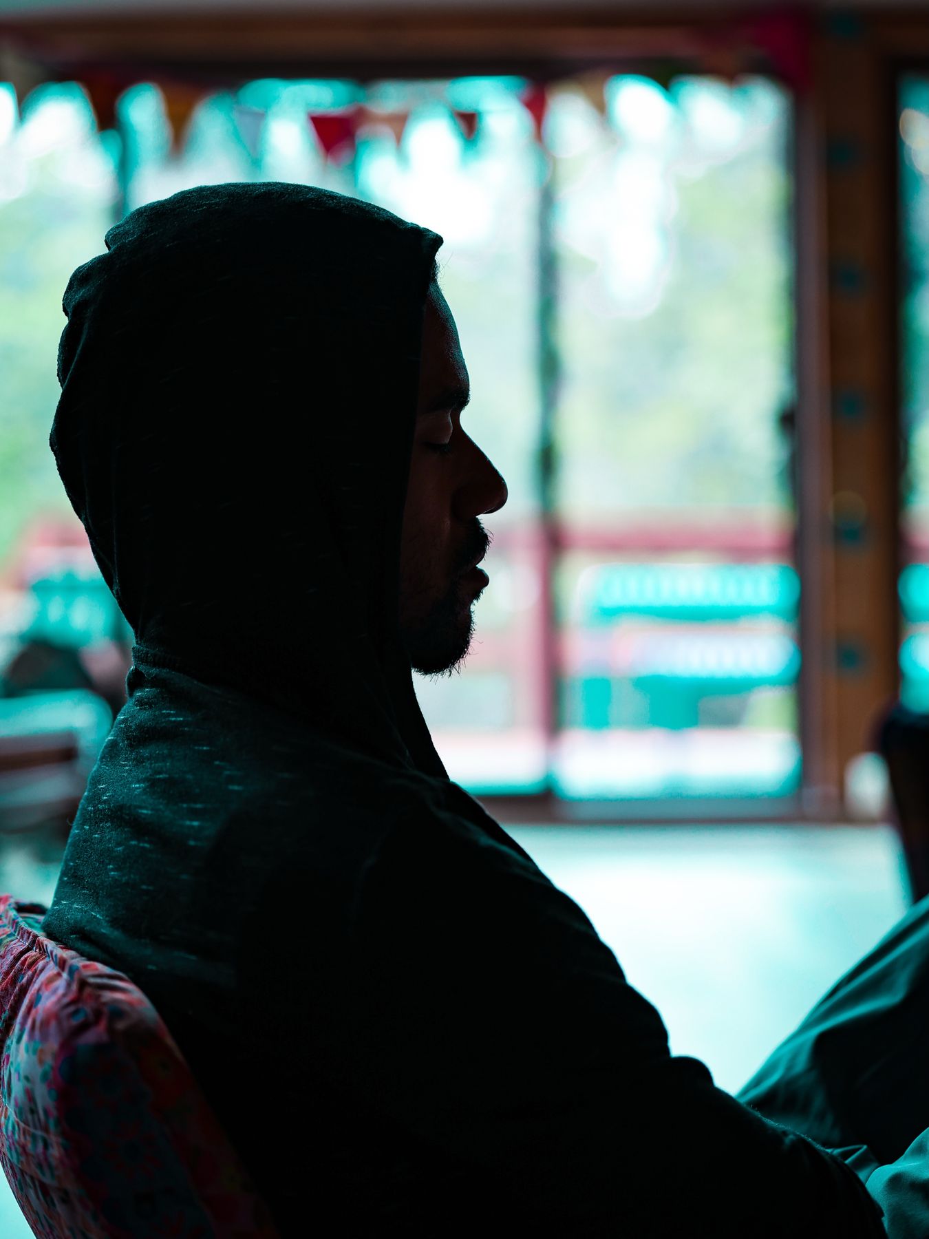 Silhouette portrait by a window